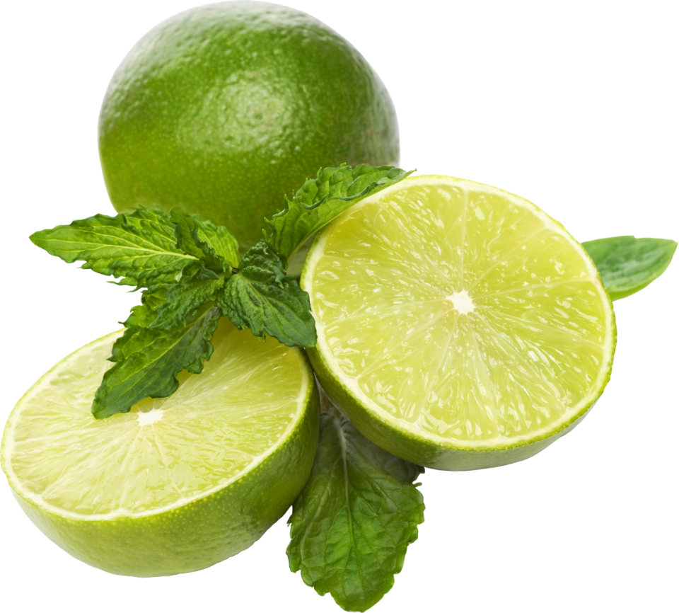 two limes with leaves on top of them