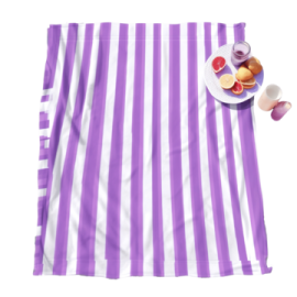 a purple and white striped towel with fruit on it