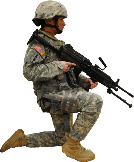 a soldier kneeling with his rifle in hand