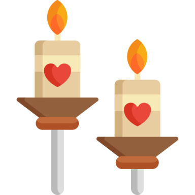 two candles with hearts on them