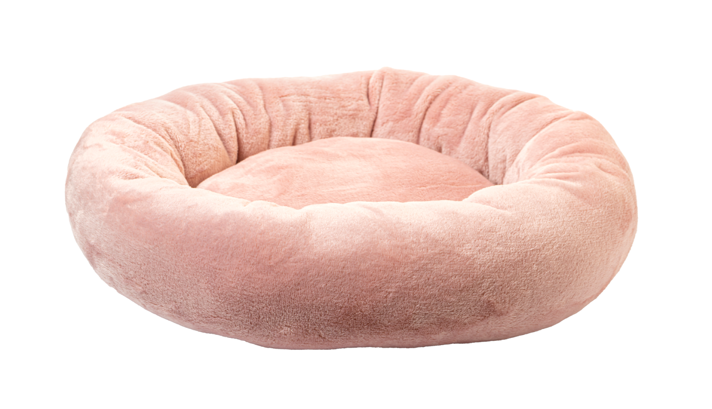 a pink dog bed on a white background
