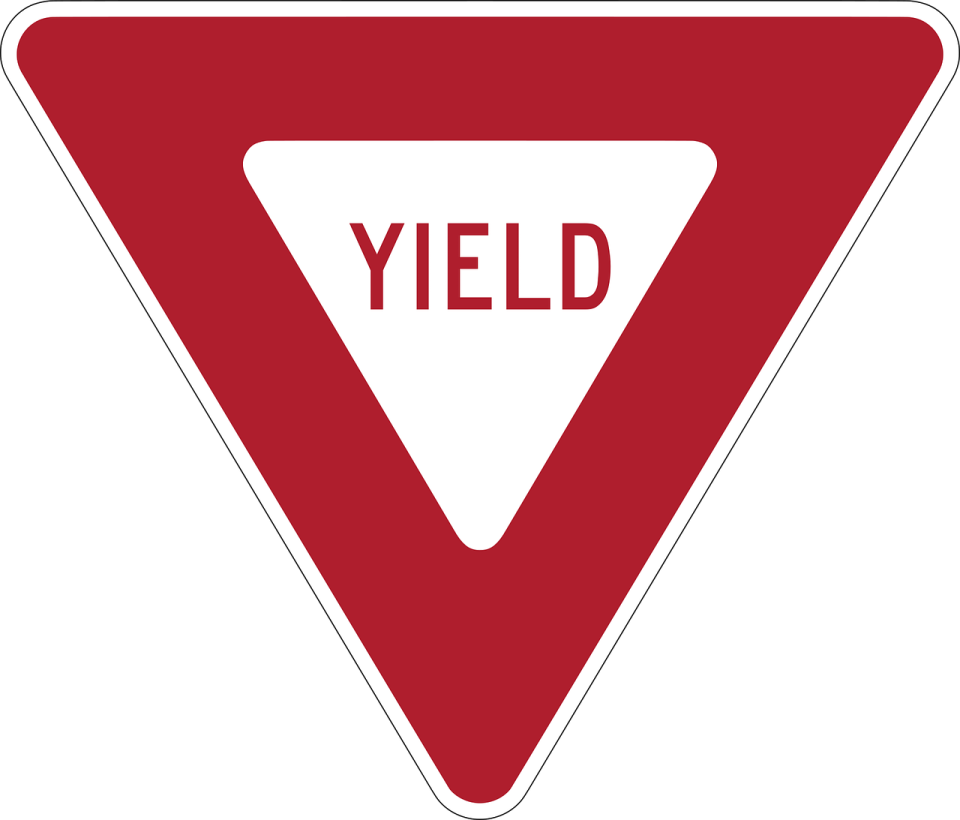 a triangle with the word yield on it