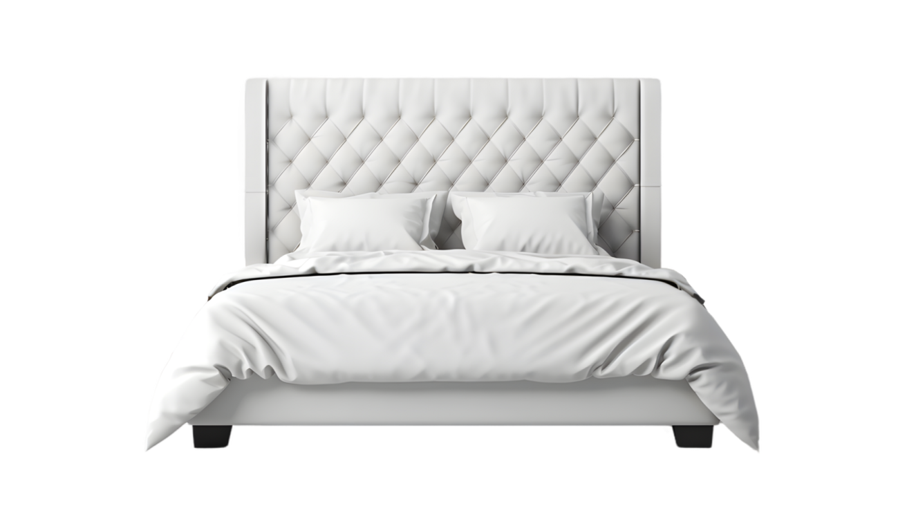 a bed with white sheets and pillows on it