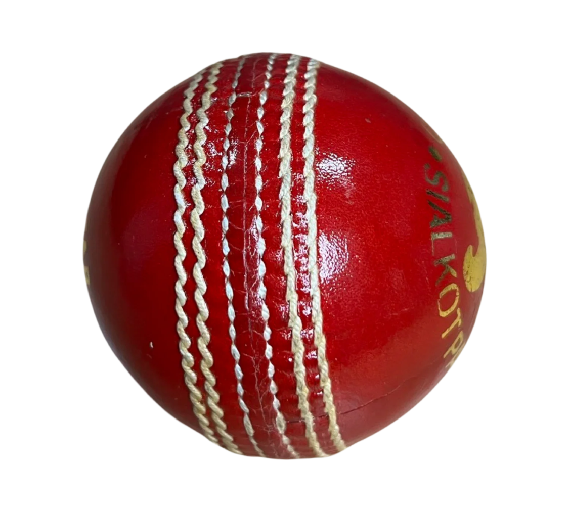 a red cricket ball on a white background