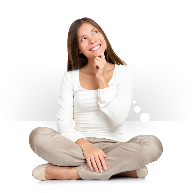 a woman sitting on the floor with her hand to her mouth
