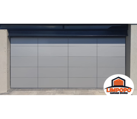a grey garage door with an orange and white logo on it