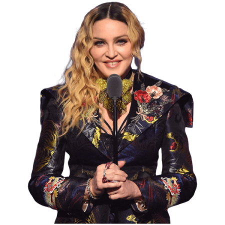 a woman in a floral suit holding a microphone