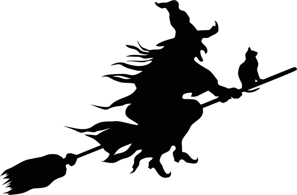 a silhouette of a witch flying on a broom