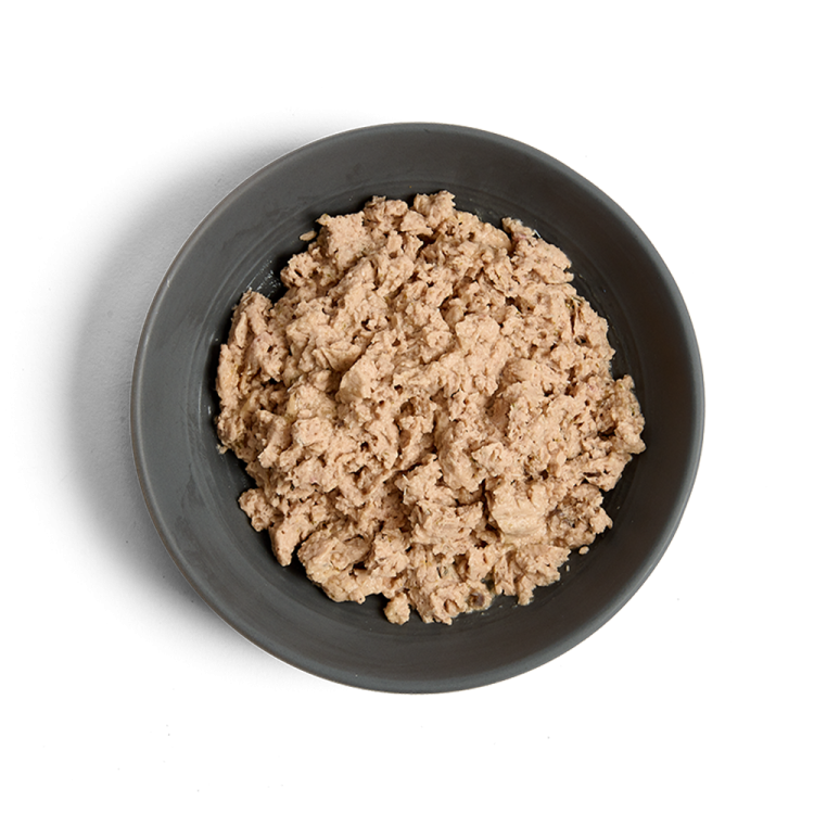 a bowl of tuna on a white background
