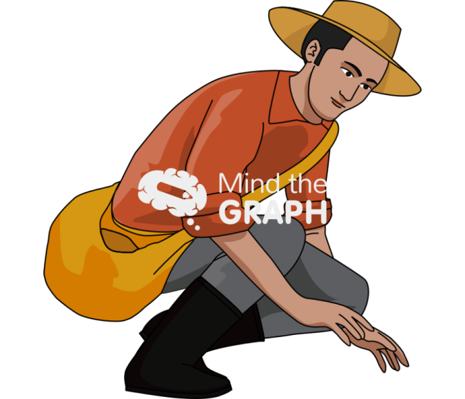a man in a hat kneeling on the ground