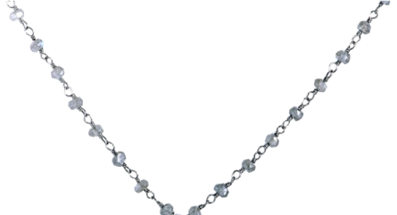 a silver necklace with blue and white crystals on it