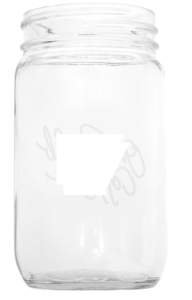 a clear glass jar with a white logo on it