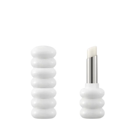 a pair of white glass knobs on a white background