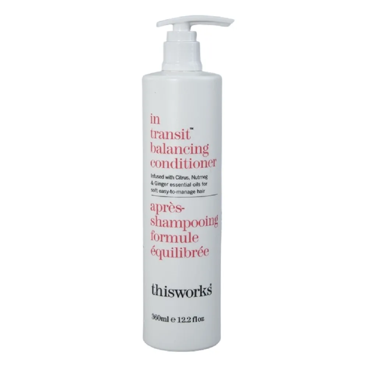 a bottle of hair products with the words in red and white