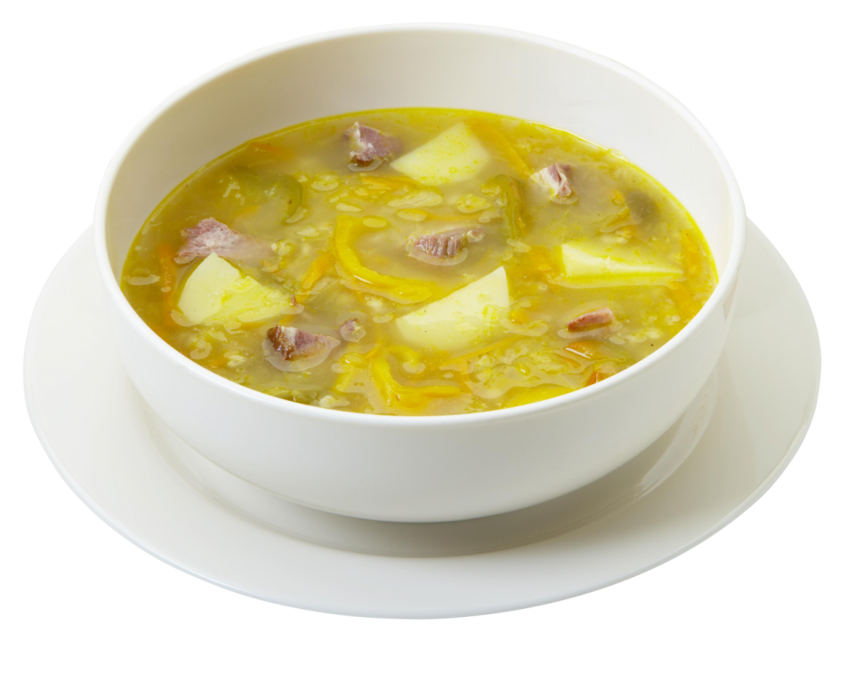 a bowl of soup on a white plate