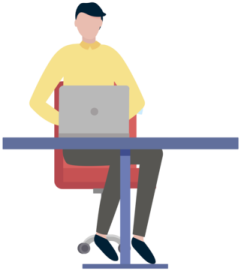 a person sitting at a table with a laptop