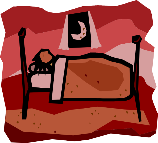 a bed with a cat sitting on top of it