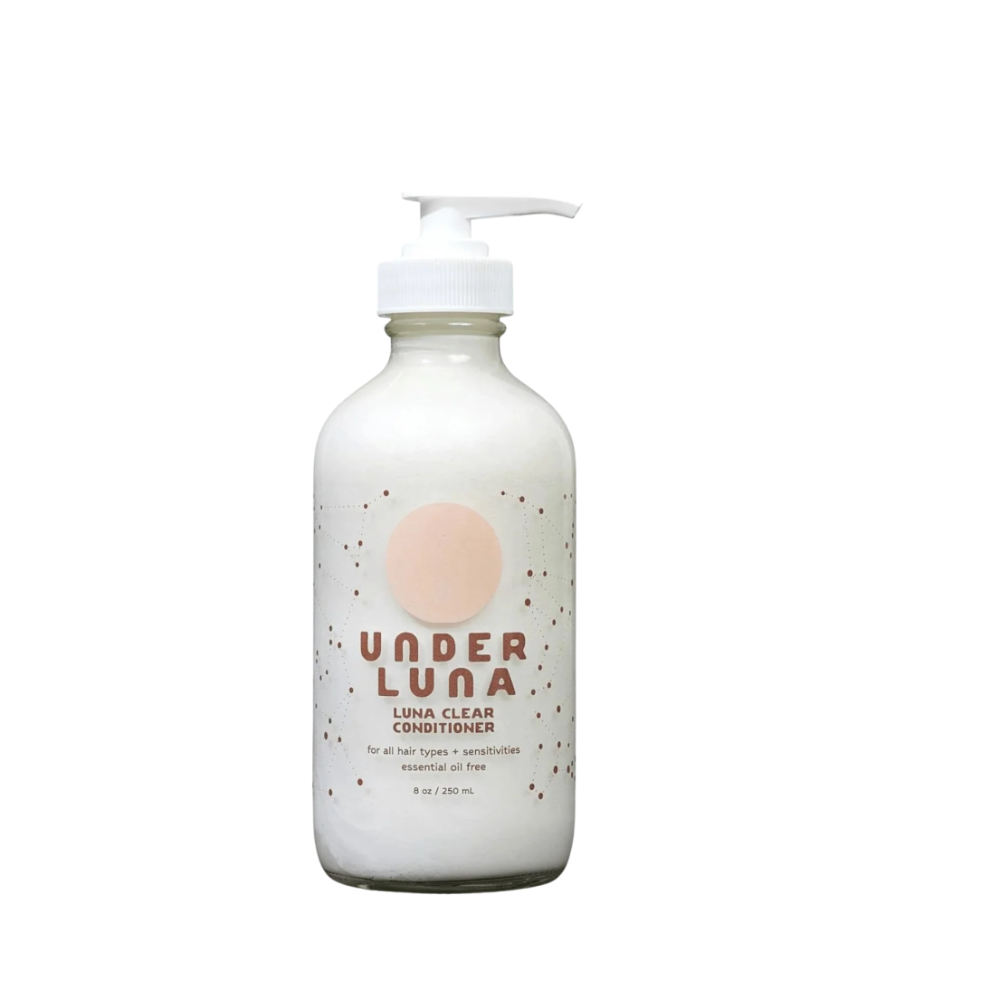 a bottle of soap with a pink dot on it