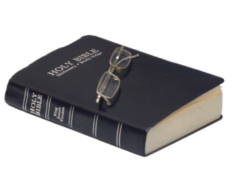 a book with glasses on top of it