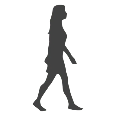 a silhouette of a woman walking down the street
