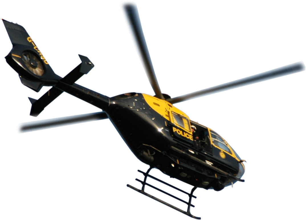 a black and yellow helicopter flying in the sky