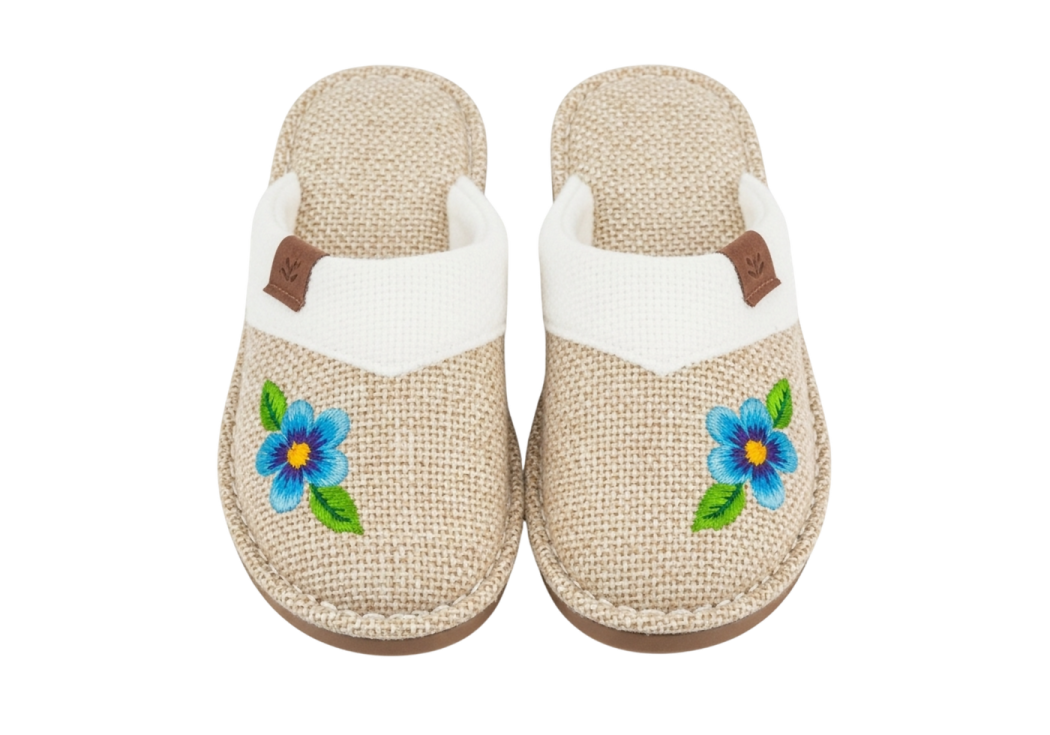 a pair of women's slippers with flowers on them