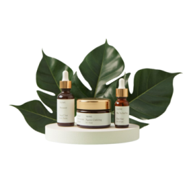 a white box with two bottles of serums and a green leaf