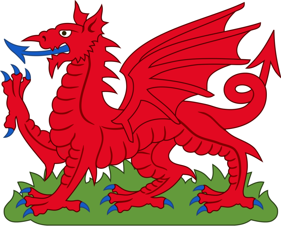 a red dragon sitting on top of grass