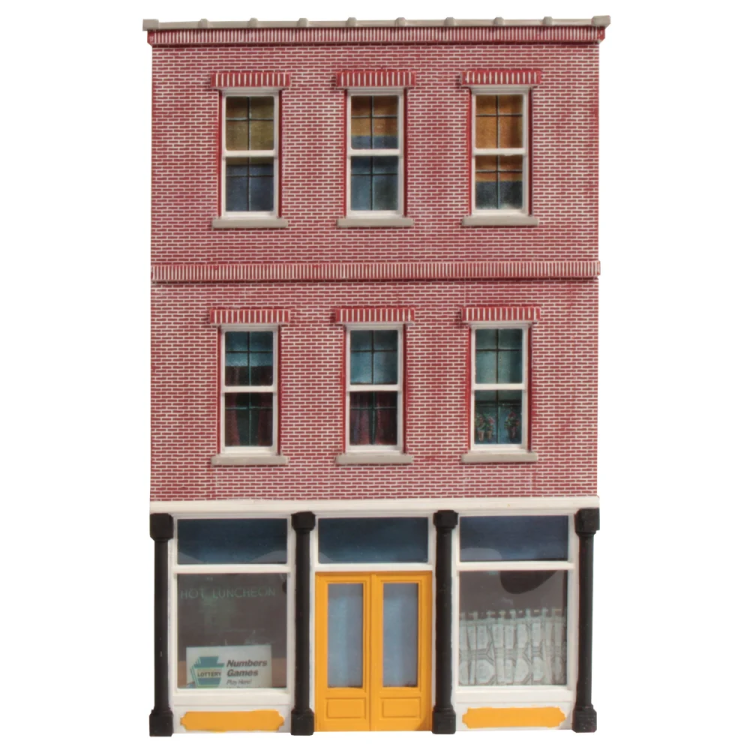 a model of a brick building with a yellow door