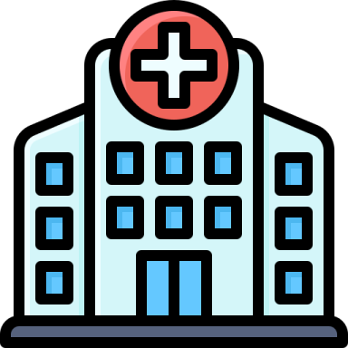 a hospital building with a cross on the front