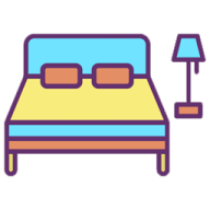 a bed with a lamp next to it