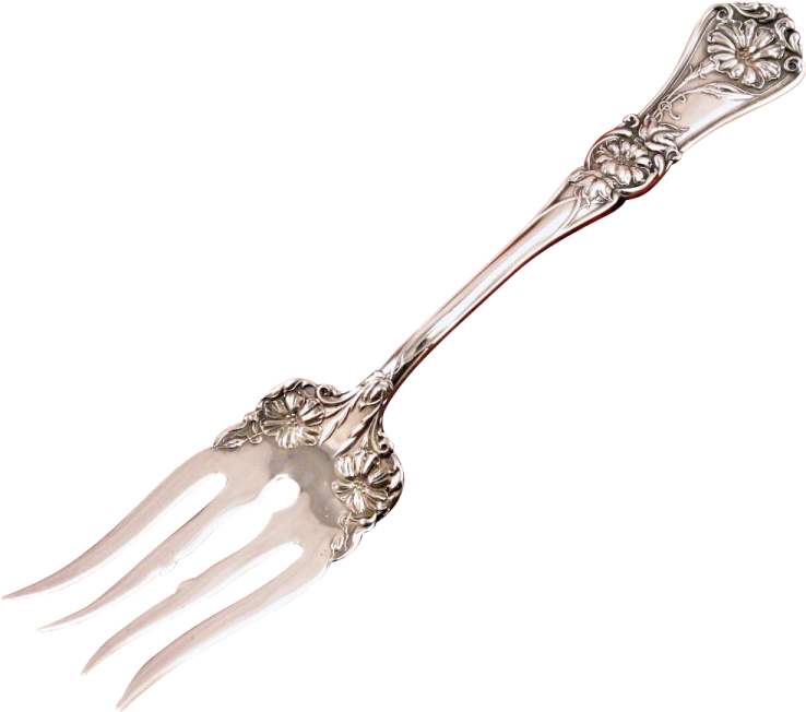 a silver spoon with an ornate design on it