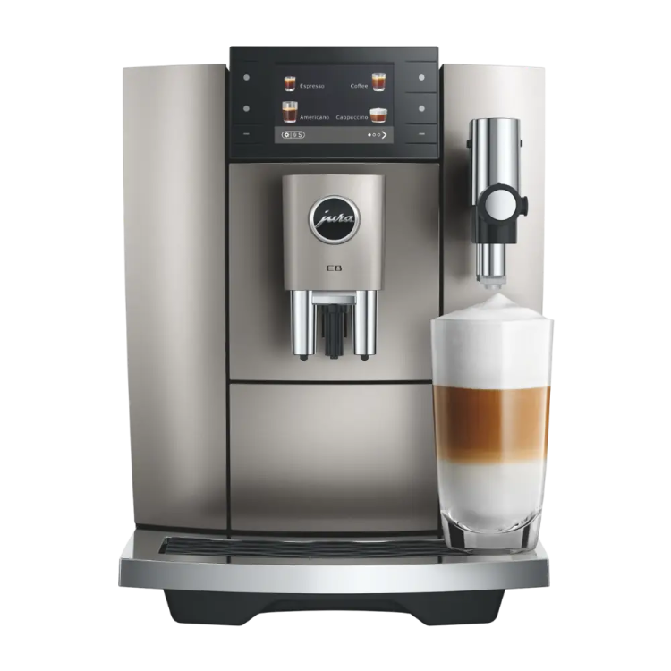 a coffee machine with a glass of milk