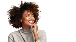 a woman with curly hair smiling and looking up