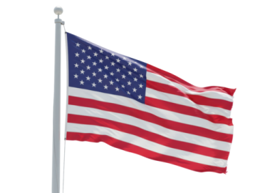 an american flag flying in the wind