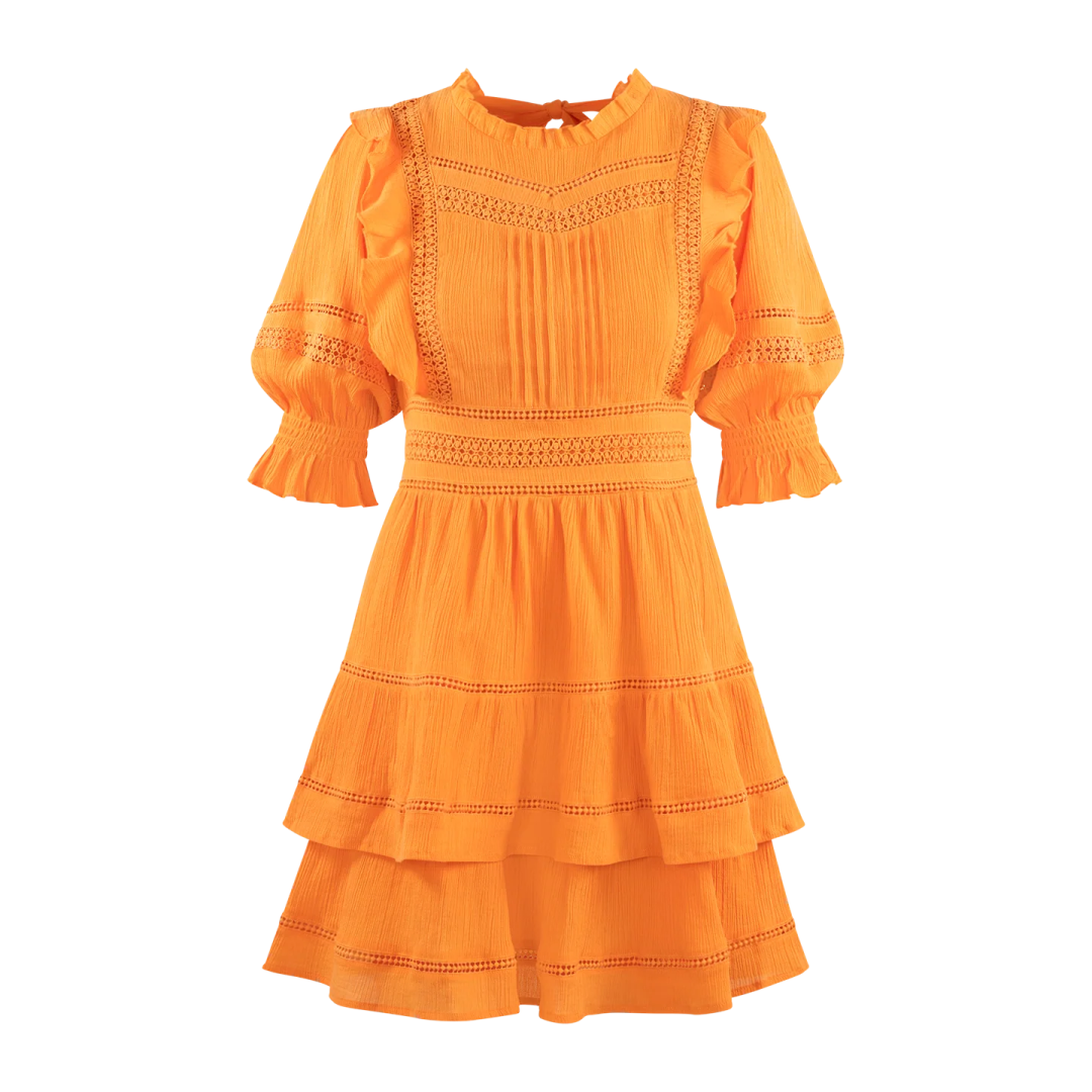 a woman in an orange dress