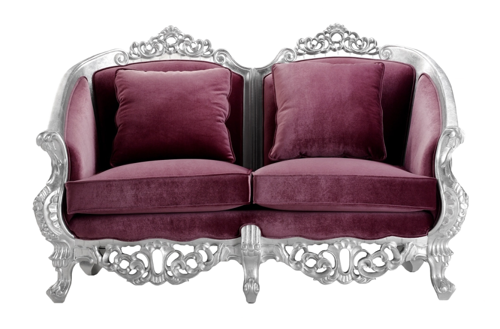 a pair of chairs with purple velvet cushions