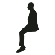 a silhouette of a man sitting on the ground
