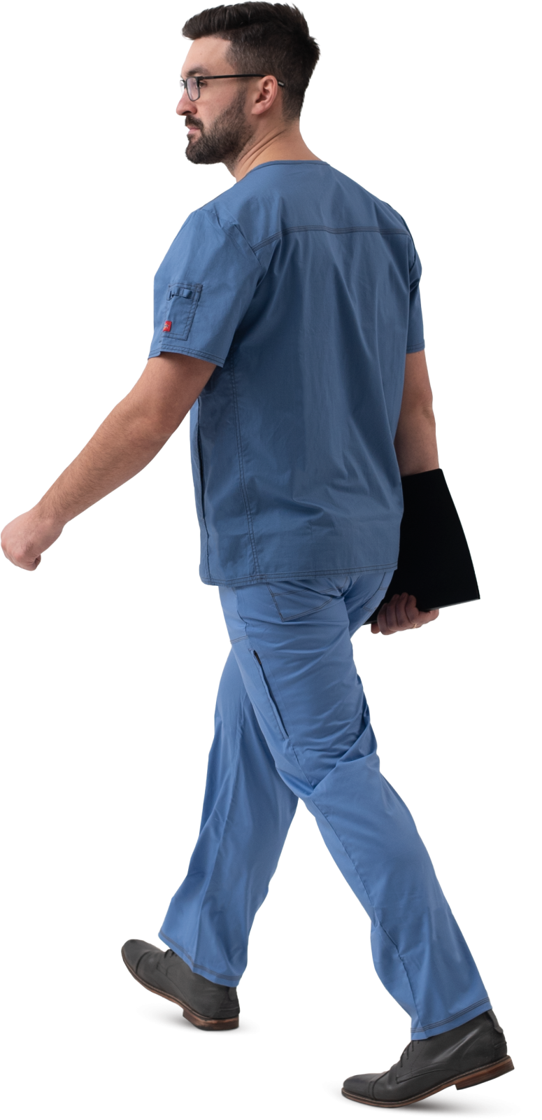 a man in scrubs walking across a white background