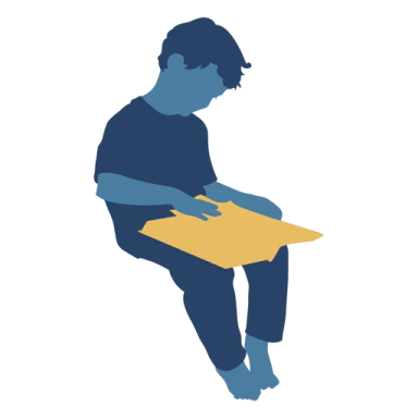 the silhouette of a man sitting on a box