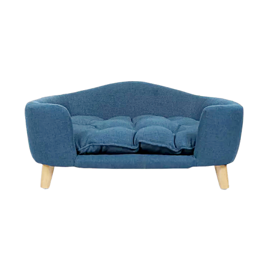 a blue sofa with wooden legs and a cushion