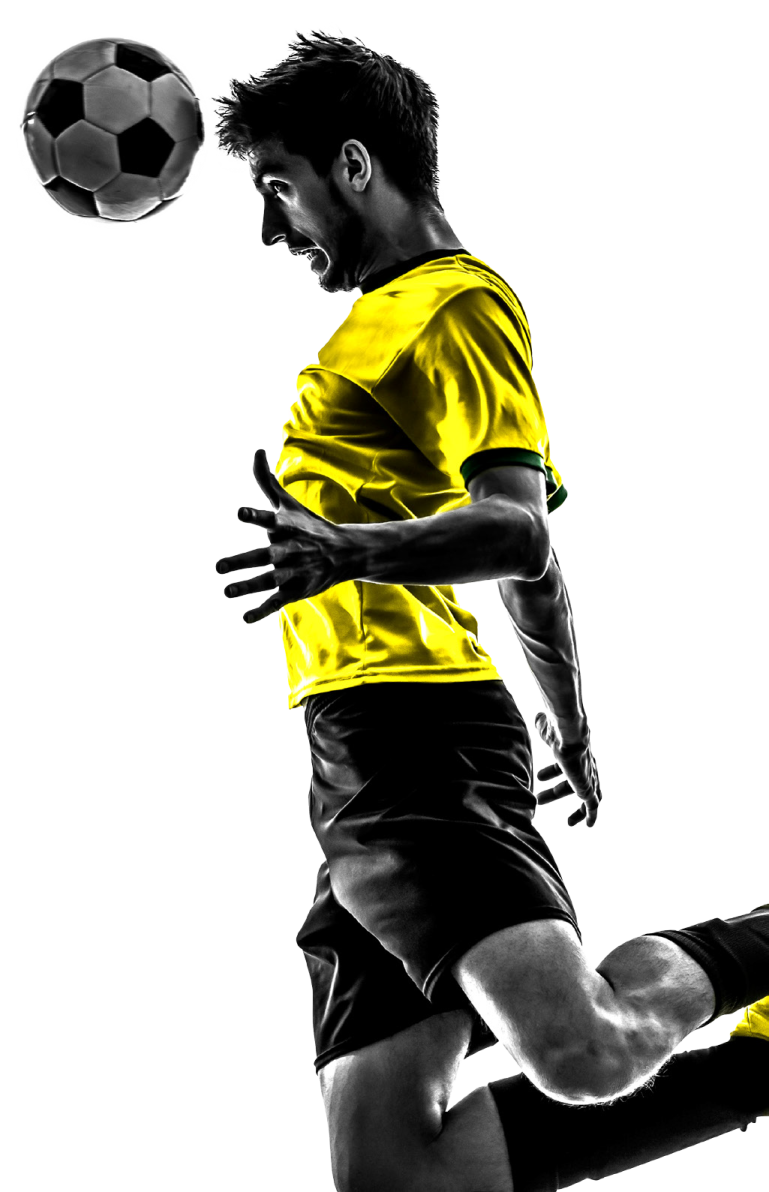 a man kicking a soccer ball in the air