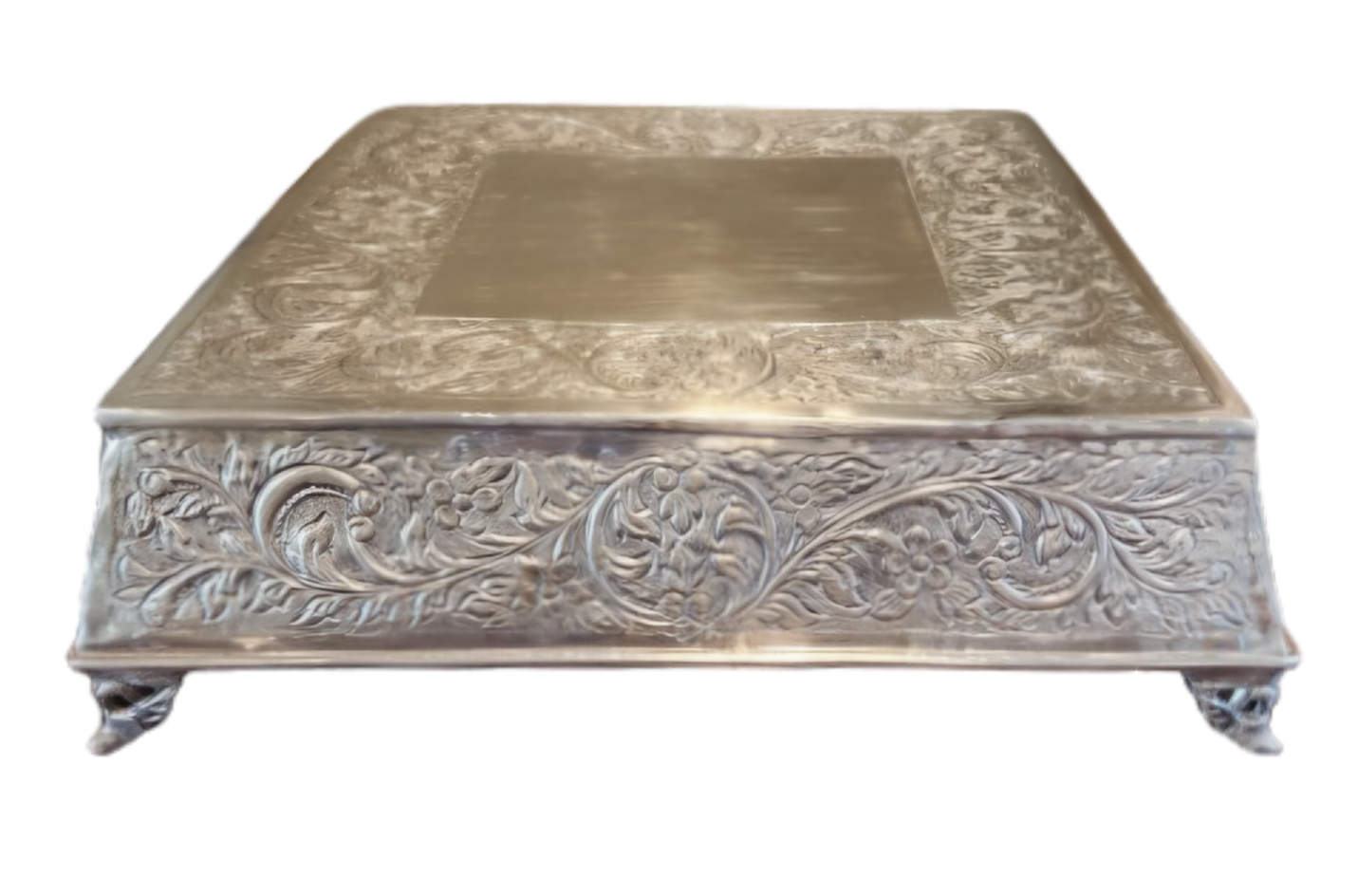 a silver box with floral design