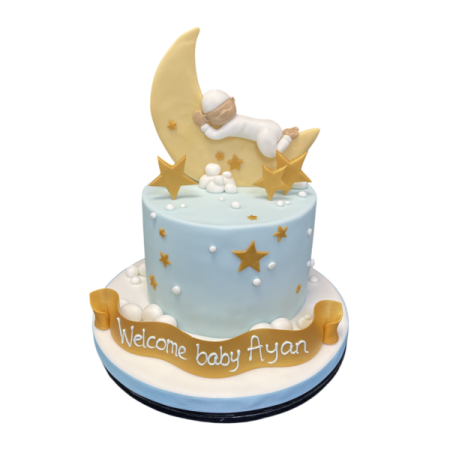 a baby is sleeping on top of a cake