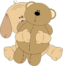 a brown teddy bear sitting on the ground