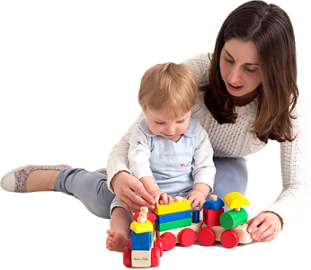 a woman playing with a child on the floor