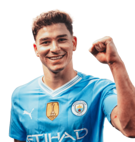 a man in a blue shirt with his fist up