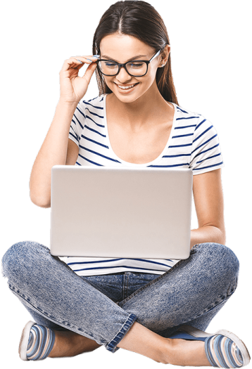 a woman sitting on the floor with her laptop