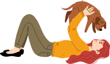 a woman laying on the ground with her dog