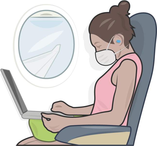 a woman sitting in an airplane with her laptop